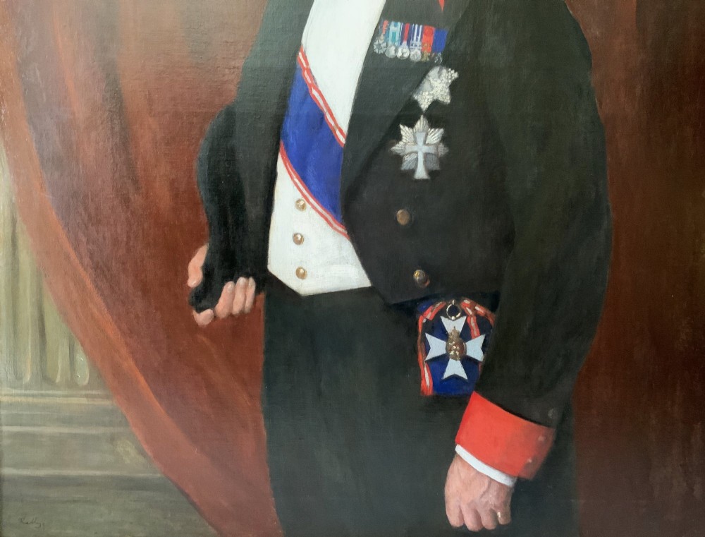 An Edwardian portrait painting of a military officer wearing decorations and set within a carved gold frame. View VII