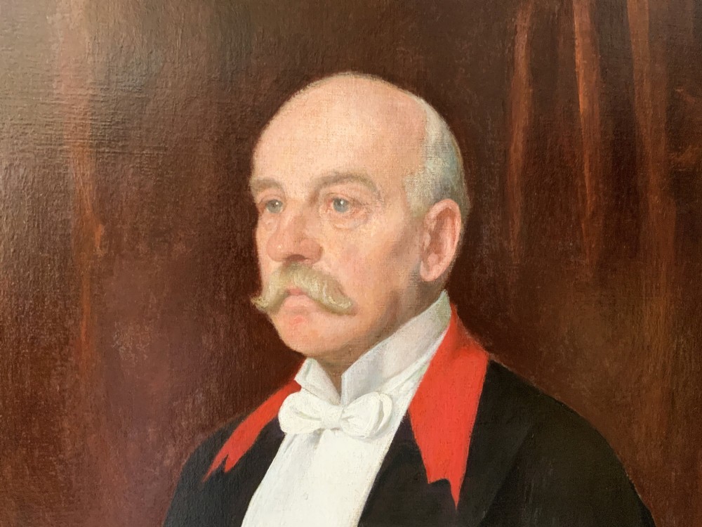 An Edwardian portrait painting of a military officer wearing decorations and set within a carved gold frame. View IX
