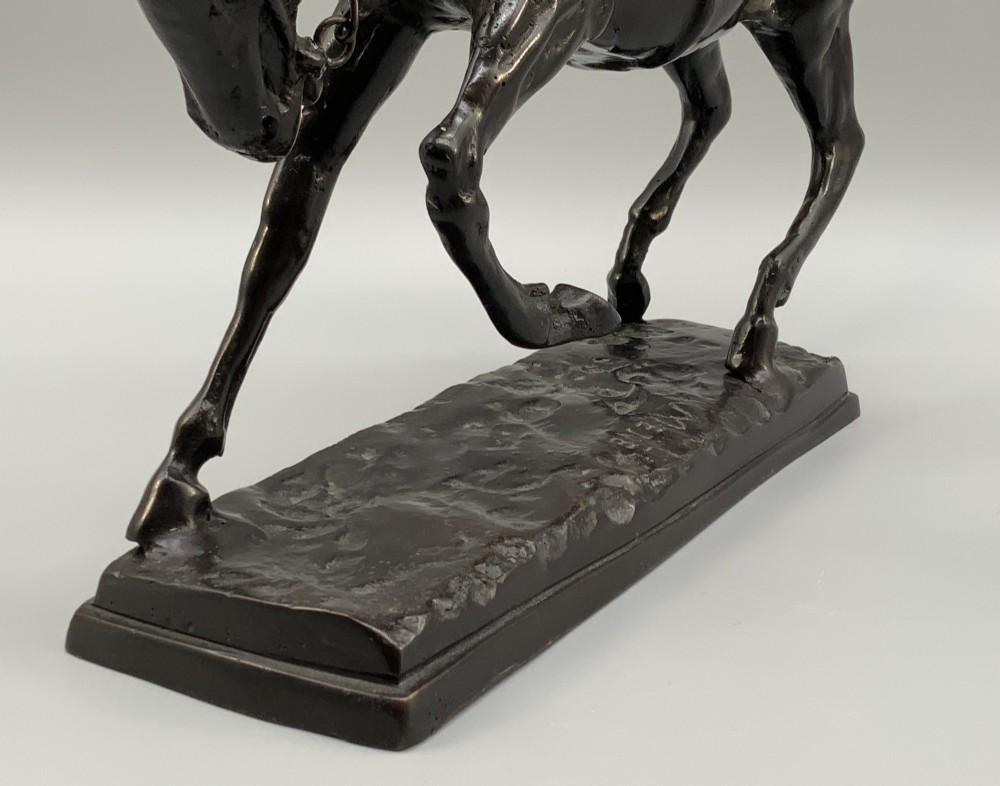 A patinated bronze sculpture depicting a racehorse and jockey mid-stride set upon a textured rectangular bronze base. View XIV