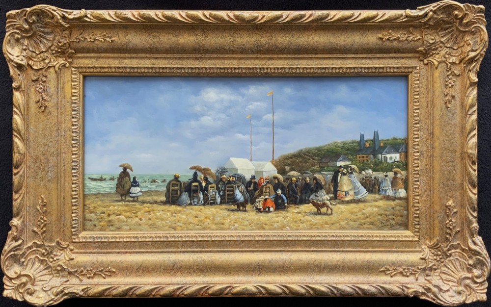 An oil painting depicting a Victorian seaside gathering on a sandy beach, enclosed within a wide carved gilt wood frame.
