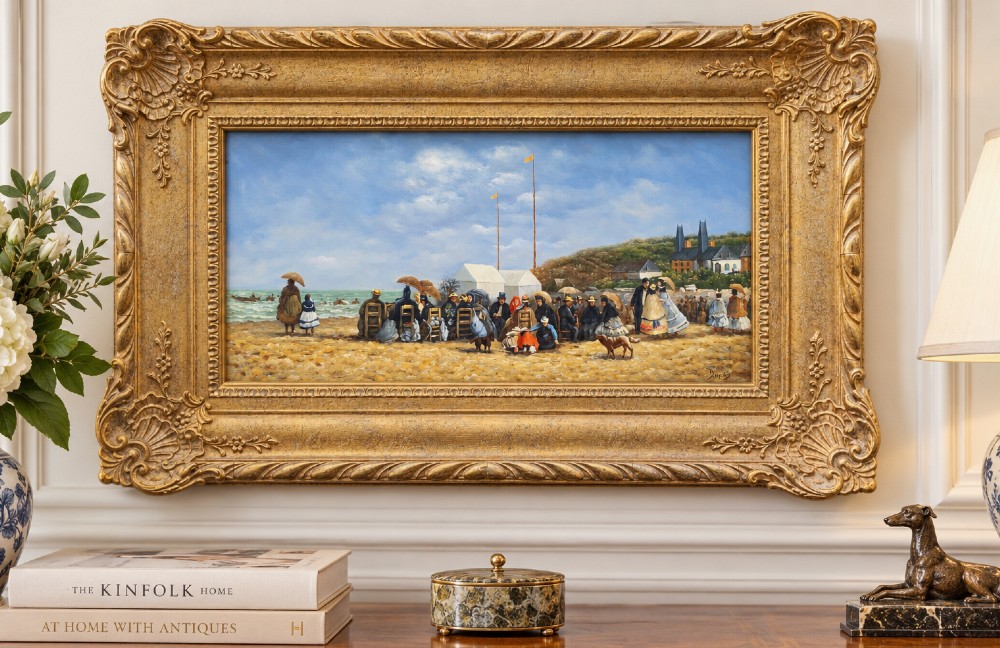 An oil painting depicting a Victorian seaside gathering on a sandy beach, enclosed within a wide carved gilt wood frame. View II