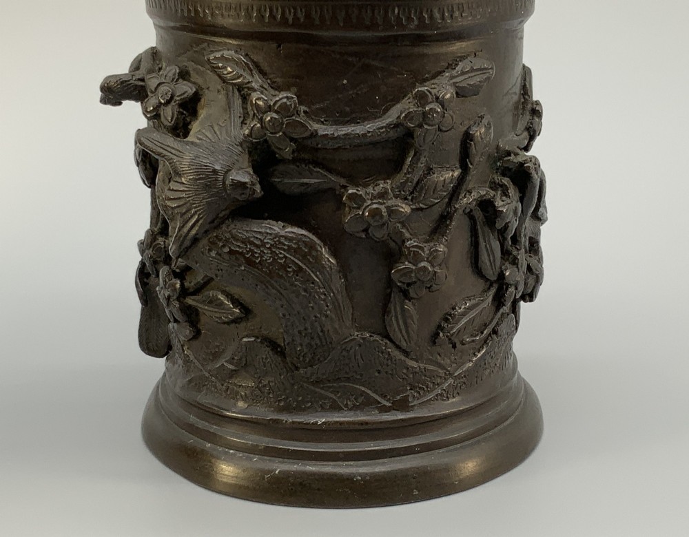 A pair of cylindrical dark patinated bronze vases featuring raised relief depictions of birds perched amongst cherry blossom branches. View VIII