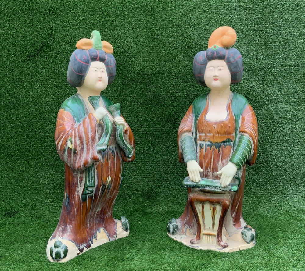 A pair of standing terracotta female musician figures in Tang Dynasty style, finished with amber, green, and cream Sancai lead glazes. View III