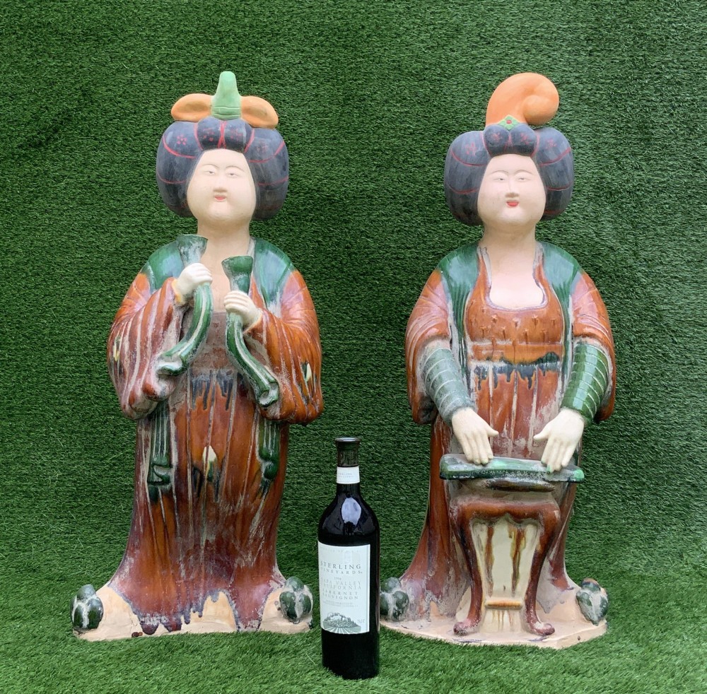 A pair of standing terracotta female musician figures in Tang Dynasty style, finished with amber, green, and cream Sancai lead glazes. View IV