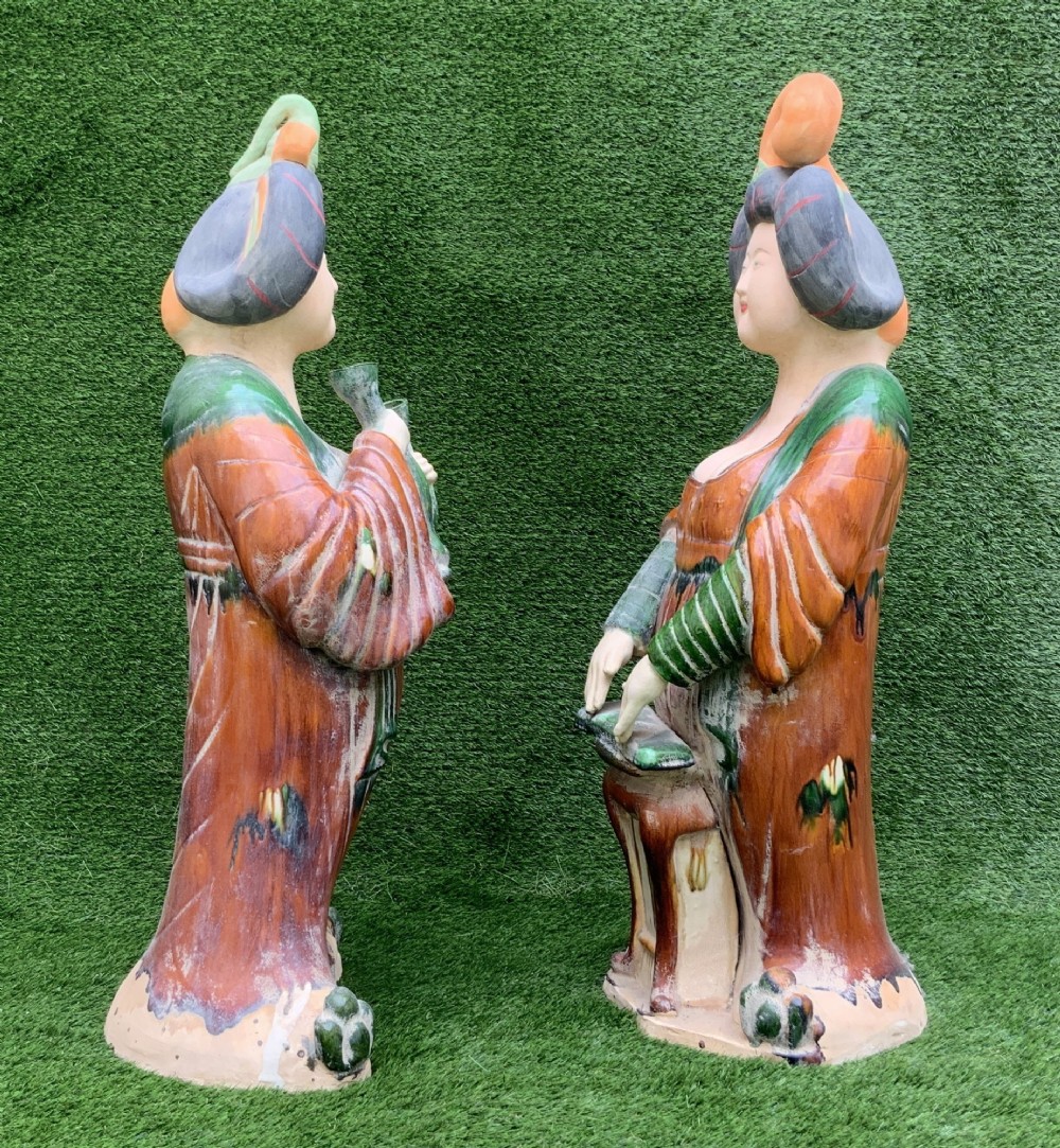 A pair of standing terracotta female musician figures in Tang Dynasty style, finished with amber, green, and cream Sancai lead glazes. View V