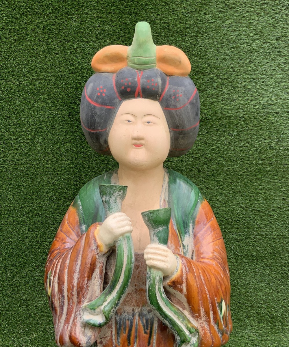 A pair of standing terracotta female musician figures in Tang Dynasty style, finished with amber, green, and cream Sancai lead glazes. View XII