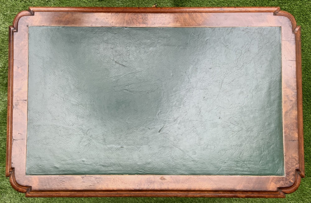 A 19th-century burr walnut work table featuring a green leather inset top, floral marquetry inlay, turned legs, and a hanging storage pouch. View IX