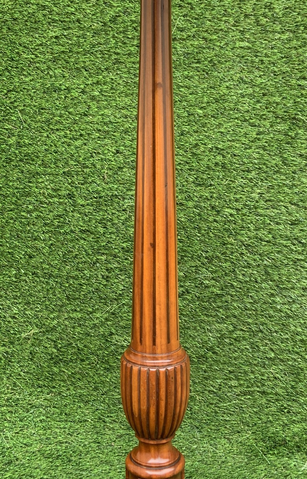 A 19th-century satinwood wine table featuring a circular top with inlaid marquetry detailing, supported by a fluted central pedestal and three downswept tripod legs. View VI