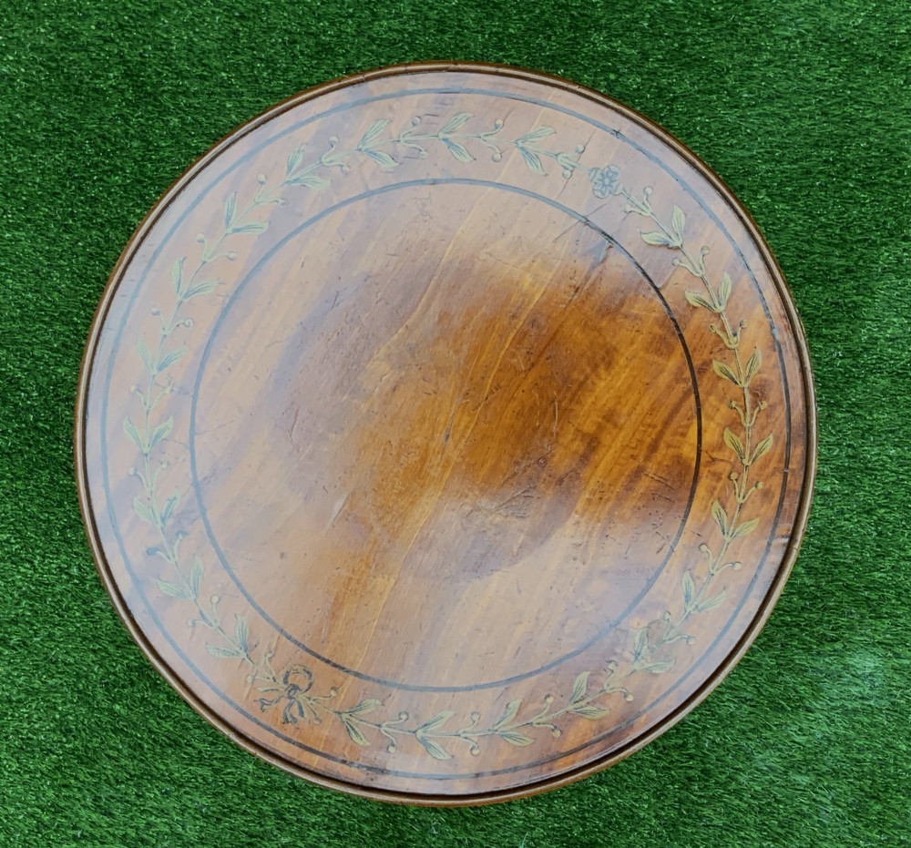 A 19th-century satinwood wine table featuring a circular top with inlaid marquetry detailing, supported by a fluted central pedestal and three downswept tripod legs. View XI