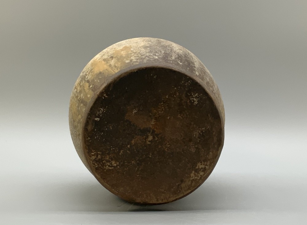 A 19th-century salt-glazed stoneware flagon featuring a mottled brown textured surface, narrow neck, flared rim, and a single loop handle. View XI