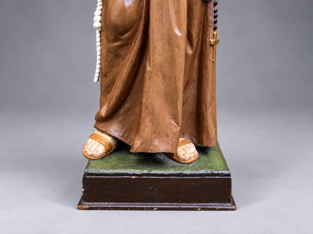 An antique polychrome carved wood sculpture depicting Saint Anthony in a brown Franciscan habit holding the Christ Child. View VIII