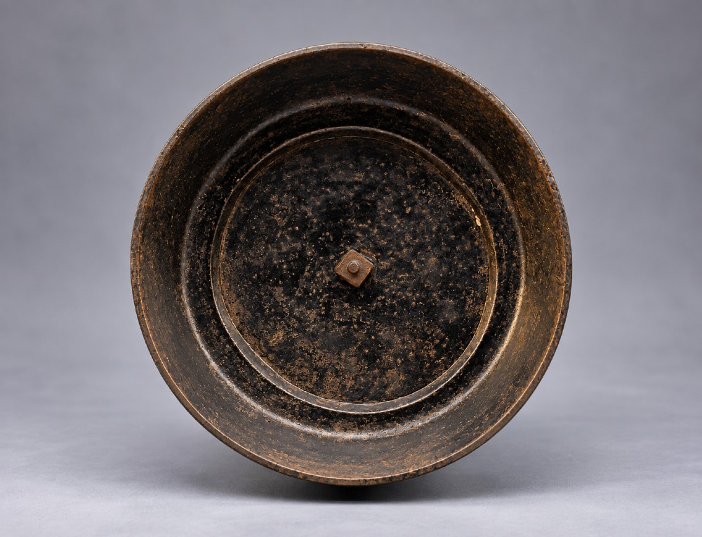 A nineteenth-century dark patinated bronze sculpture depicting two fishermen standing in a small vessel atop sculpted ocean waves, mounted on a rounded base. View XI