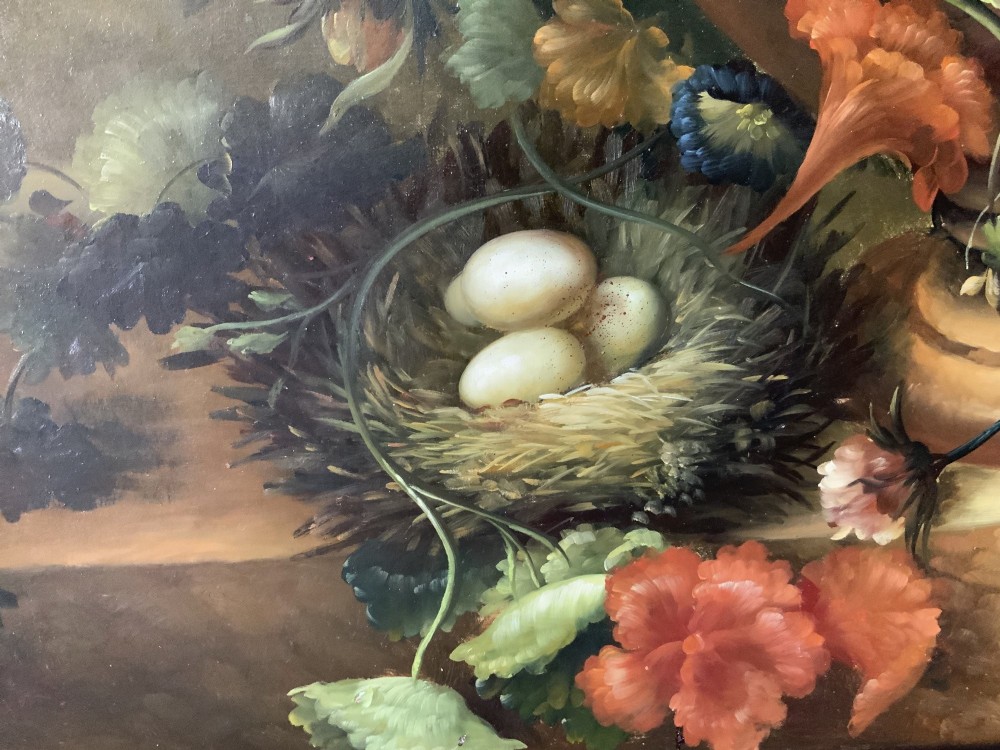 A large scale oil painting featuring a dense arrangement of colourful flowers in a carved classical urn set within a painted stone archway. View XIII