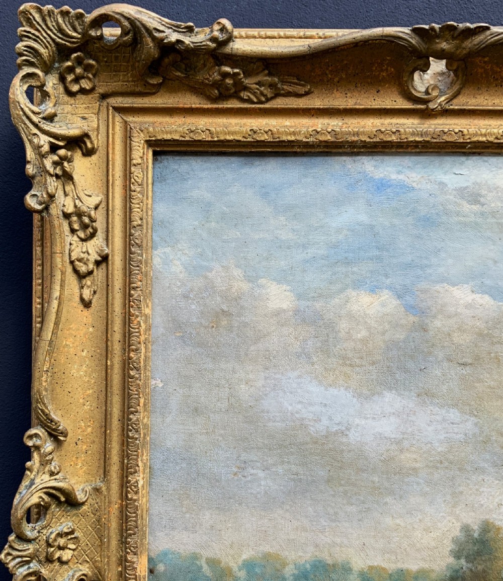 A Victorian landscape oil painting depicting a farm girl, cattle, and chickens along a dirt path with a thatched cottage in the background, set within a heavily carved gilt frame. View IX