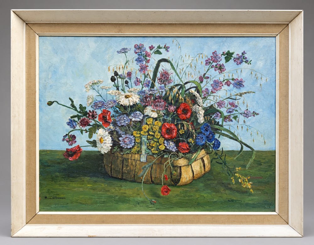 A framed floral still life oil painting depicting a woven basket filled with colourful wildflowers including poppies and daisies against a light blue backdrop.
