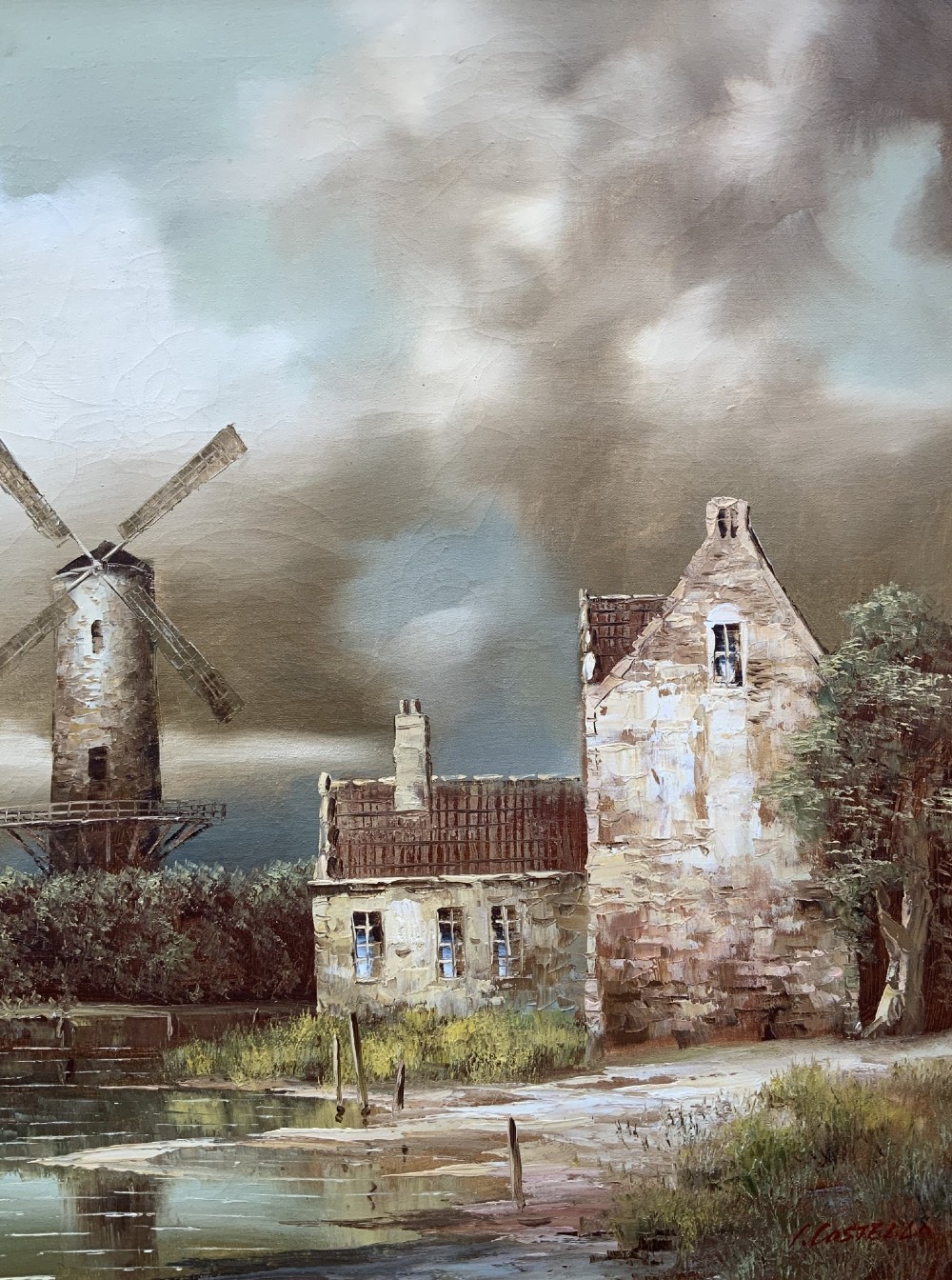 A horizontal oil painting depicting Dutch windmills and stone buildings along a riverbank under a cloudy sky, presented in an ornate gilt frame. View VI