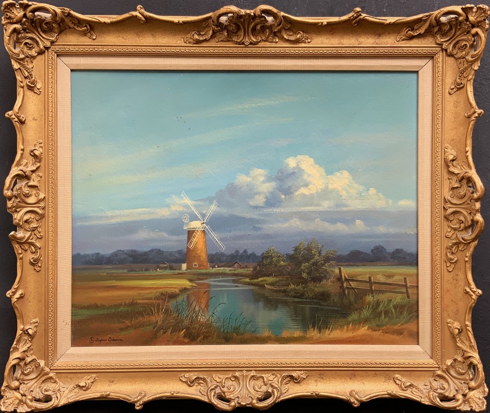 An oil painting depicting Horsey Mill set amidst the Norfolk Broads under a cloud-filled sky, presented in an elaborate gilded swept frame. View II