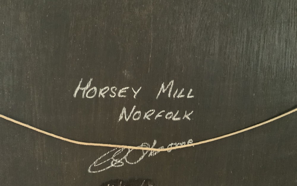 An oil painting depicting Horsey Mill set amidst the Norfolk Broads under a cloud-filled sky, presented in an elaborate gilded swept frame. View XI