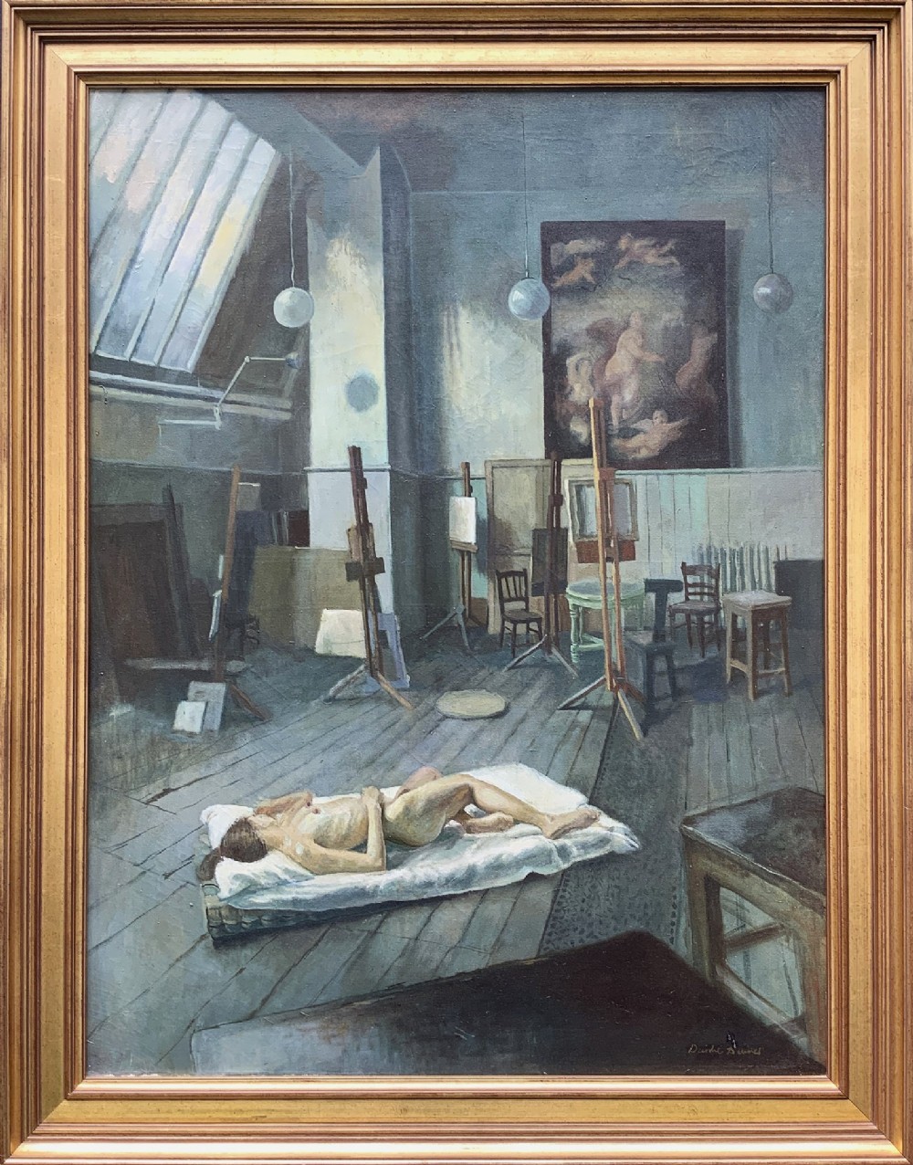 An oil painting on canvas depicting a reclining nude model on a studio floor surrounded by wooden easels, a skylight, and studio furniture, set within a stepped gilt timber frame.