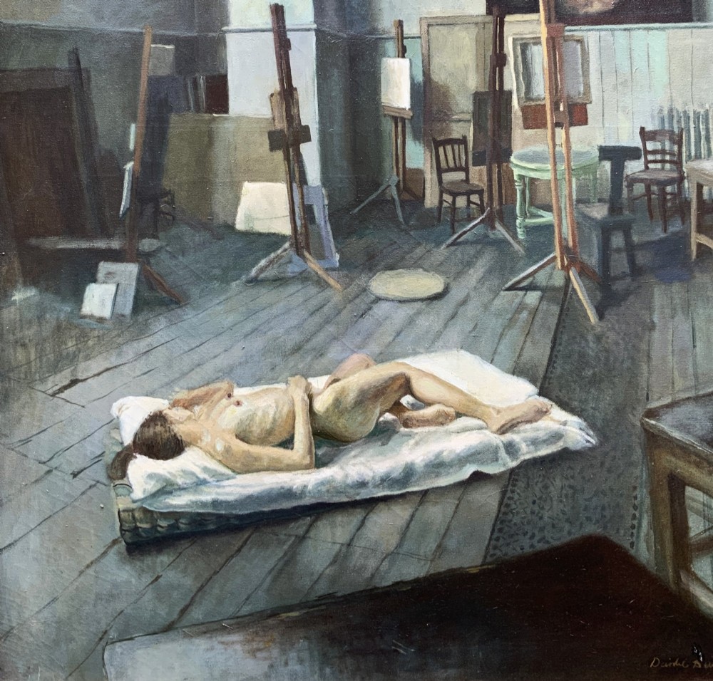 An oil painting on canvas depicting a reclining nude model on a studio floor surrounded by wooden easels, a skylight, and studio furniture, set within a stepped gilt timber frame. View V