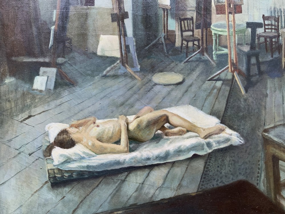 An oil painting on canvas depicting a reclining nude model on a studio floor surrounded by wooden easels, a skylight, and studio furniture, set within a stepped gilt timber frame. View VIII
