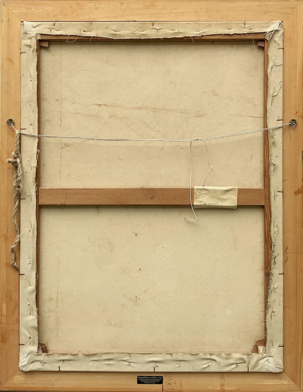 An oil painting on canvas depicting a reclining nude model on a studio floor surrounded by wooden easels, a skylight, and studio furniture, set within a stepped gilt timber frame. View X