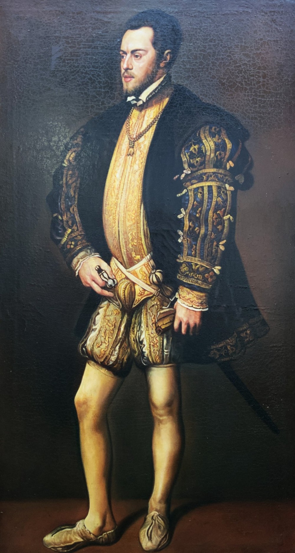 A full-length oil painting depicting Philip II of Spain in Renaissance attire, housed inside an ebonised frame with gilt mouldings. View III