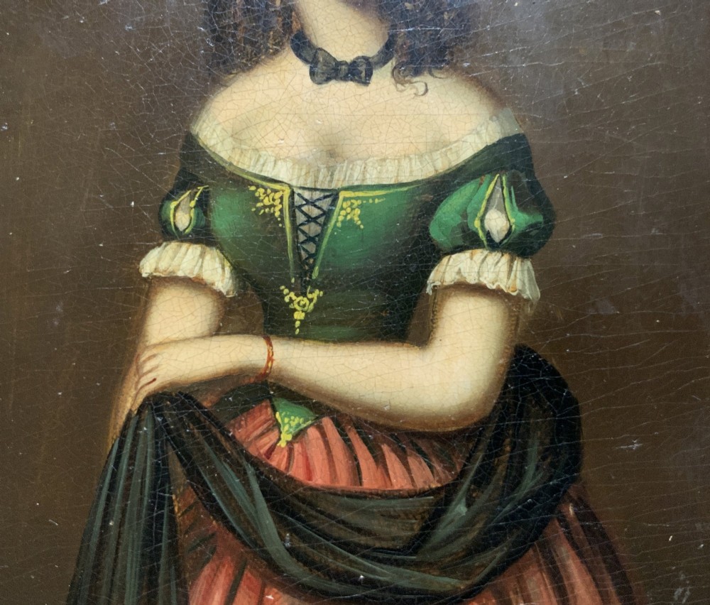 A framed miniature oil portrait depicting a Victorian woman with dark curly hair in a green and red dress, enclosed in a gilded wooden frame with egg-and-dart detail. View VI