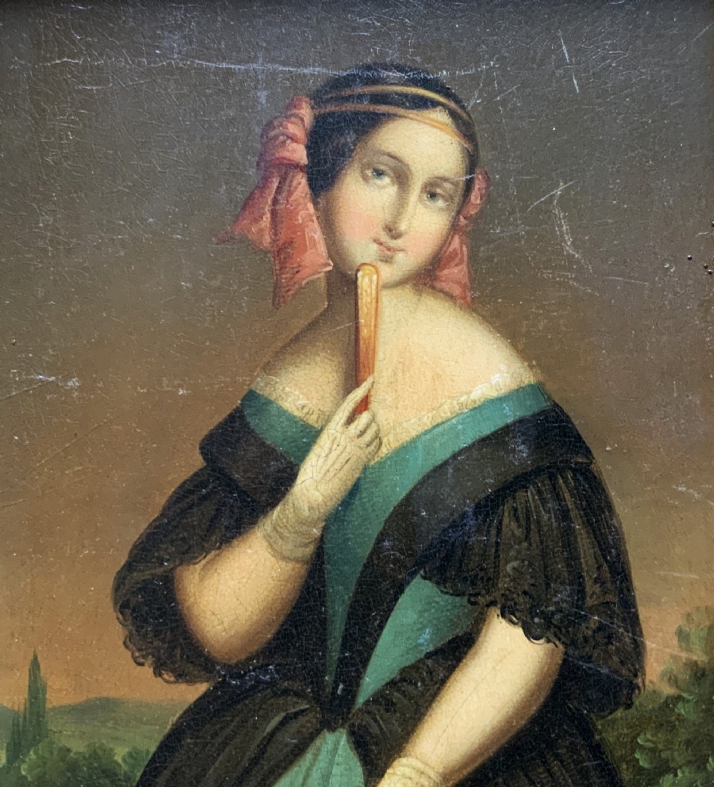 A framed 19th-century miniature oil painting depicting a seated woman in a teal dress and dark shawl holding a fan. View III