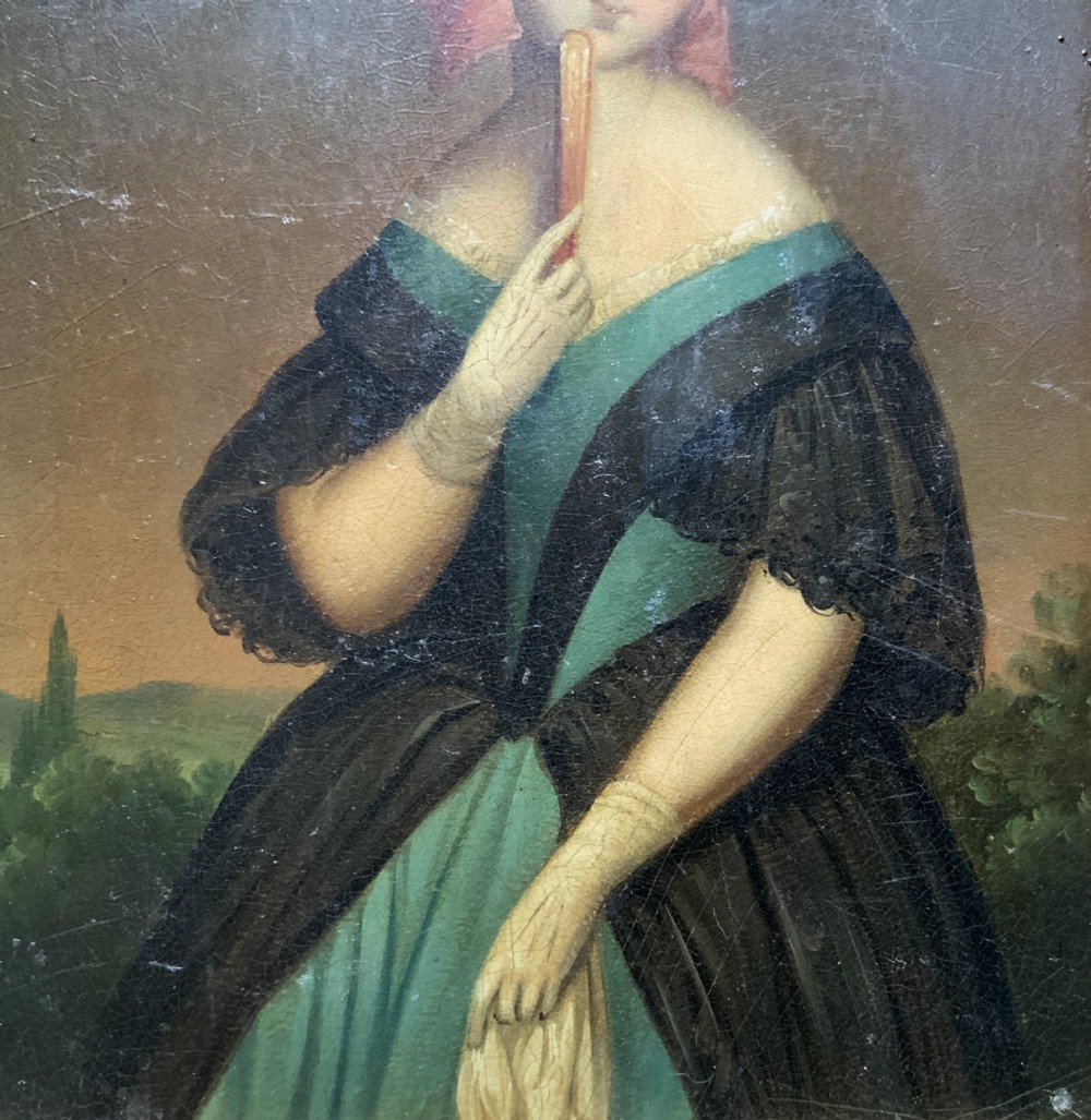 A framed 19th-century miniature oil painting depicting a seated woman in a teal dress and dark shawl holding a fan. View IV