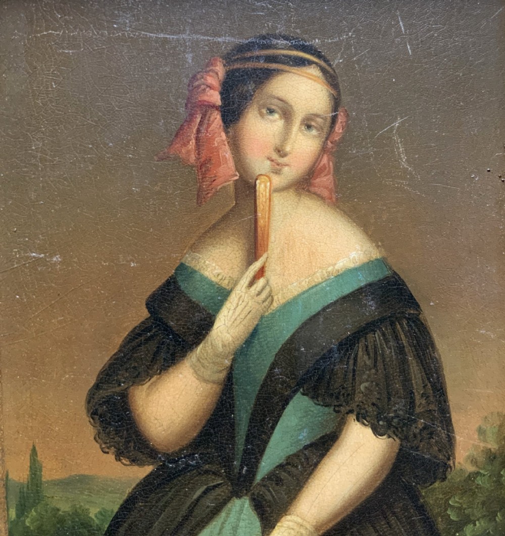 A framed 19th-century miniature oil painting depicting a seated woman in a teal dress and dark shawl holding a fan. View V