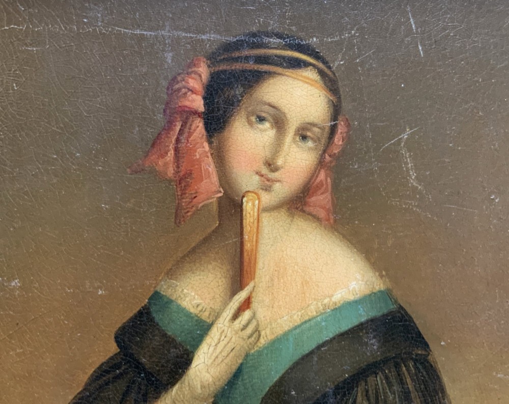 A framed 19th-century miniature oil painting depicting a seated woman in a teal dress and dark shawl holding a fan. View VI