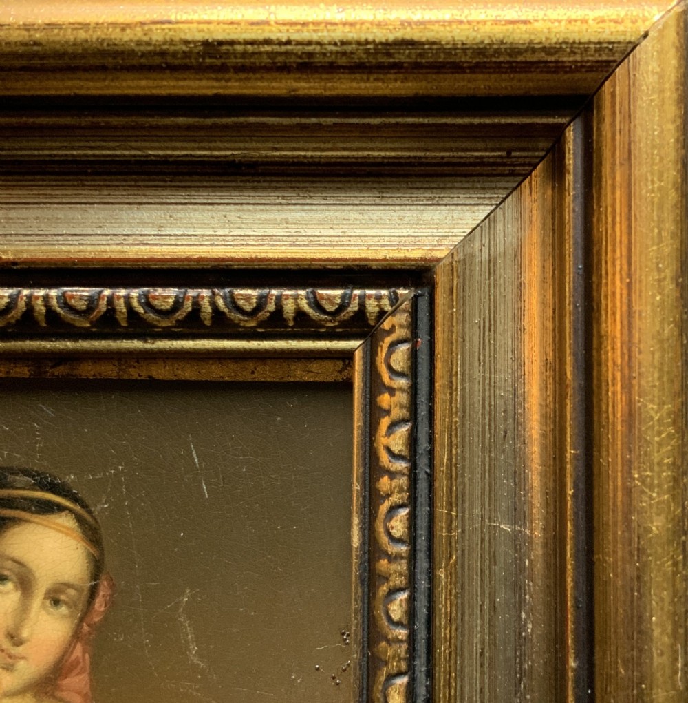 A framed 19th-century miniature oil painting depicting a seated woman in a teal dress and dark shawl holding a fan. View VII