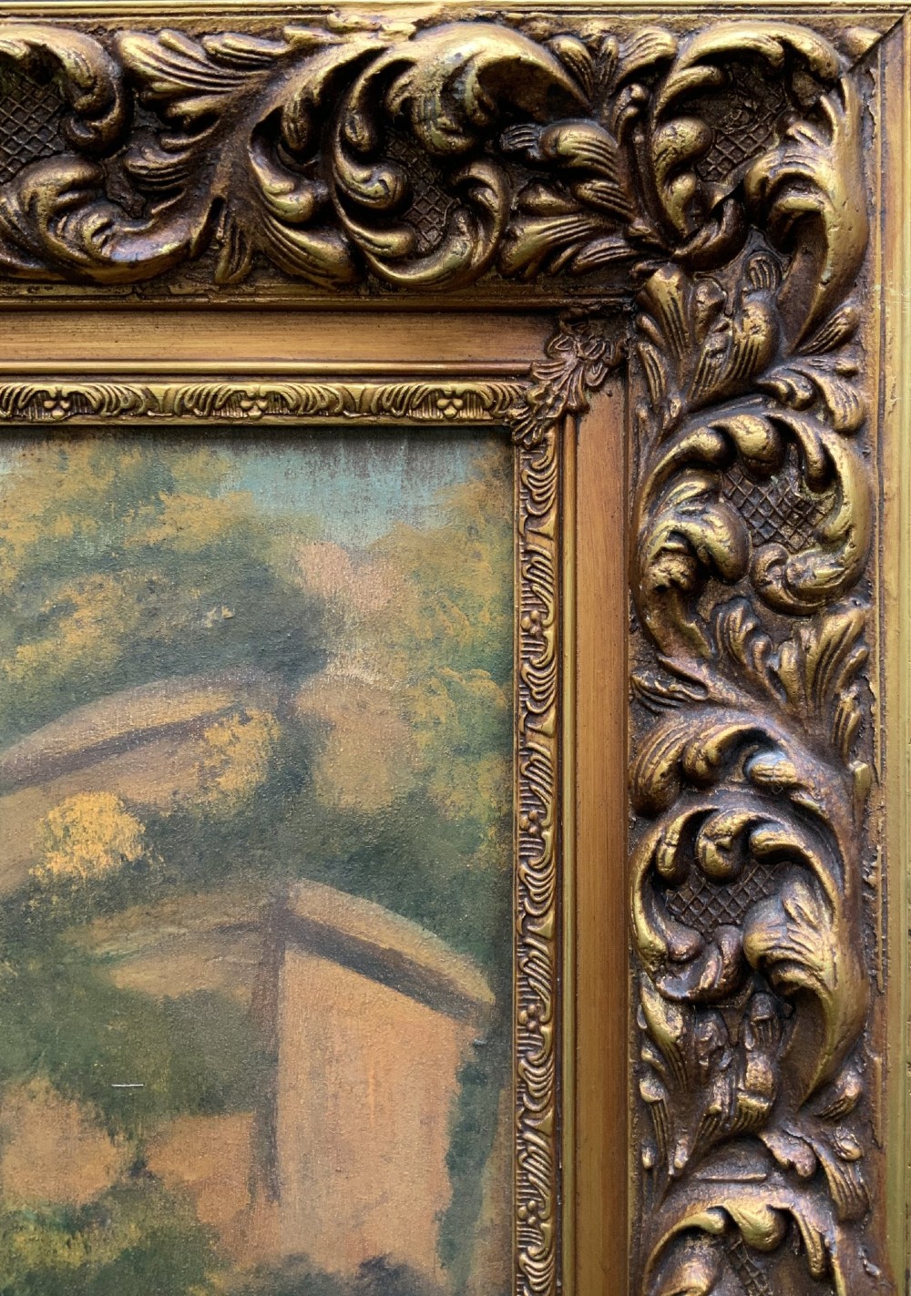 A naive equestrian oil painting depicting a grey horse, a handler in a blue jacket, and a dog beside a river, enclosed in a deeply carved gold gilt frame. View XI