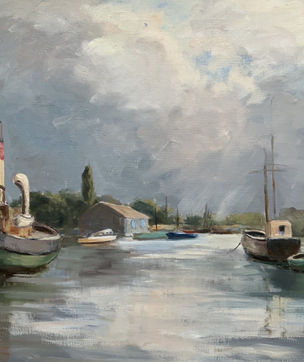 A framed horizontal oil painting depicting a calm harbour scene with steam tugboats, moored vessels, stone buildings, and a cloudy grey sky. View IV