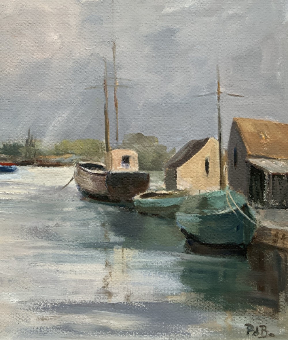 A framed horizontal oil painting depicting a calm harbour scene with steam tugboats, moored vessels, stone buildings, and a cloudy grey sky. View VI