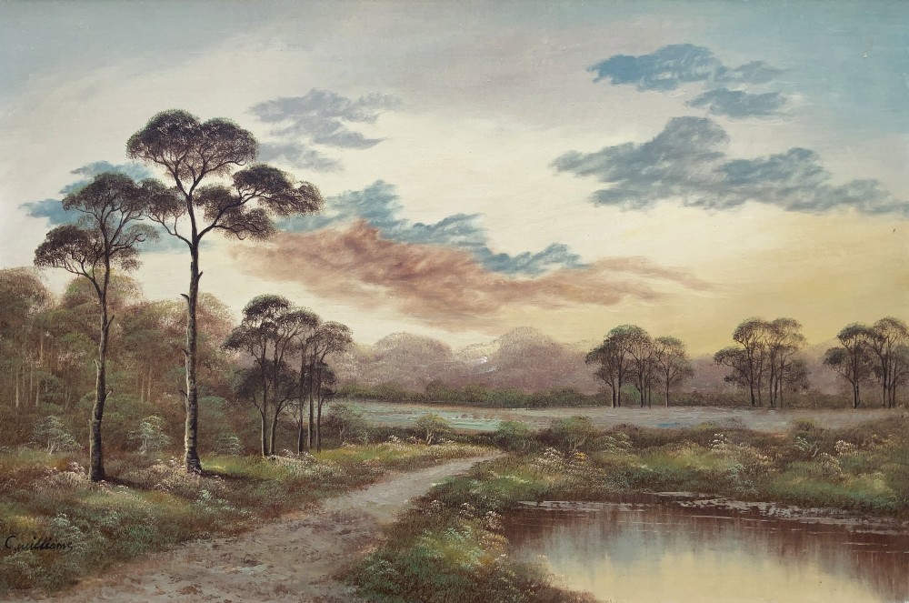 A twentieth-century framed oil painting depicting a countryside path alongside a reflective pond, surrounded by tall trees and distant hills under a clouded sky. View II