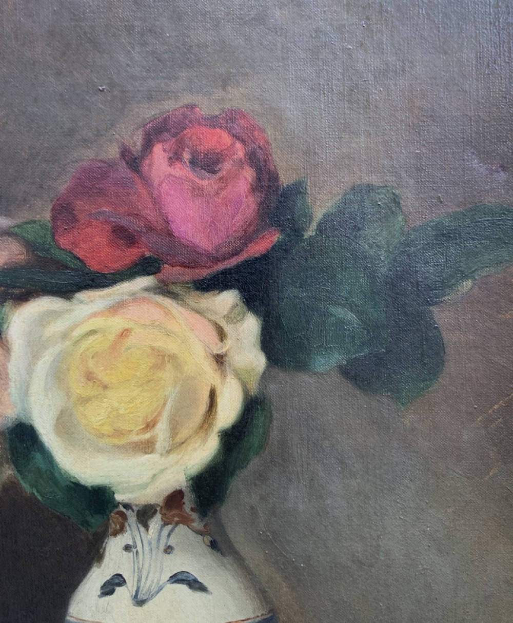 An early 20th-century French Impressionist oil painting depicting pink and yellow roses in a ceramic vase, housed within a moulded gold-gilded frame. View V