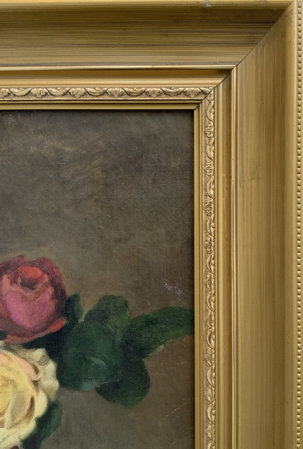 An early 20th-century French Impressionist oil painting depicting pink and yellow roses in a ceramic vase, housed within a moulded gold-gilded frame. View IX