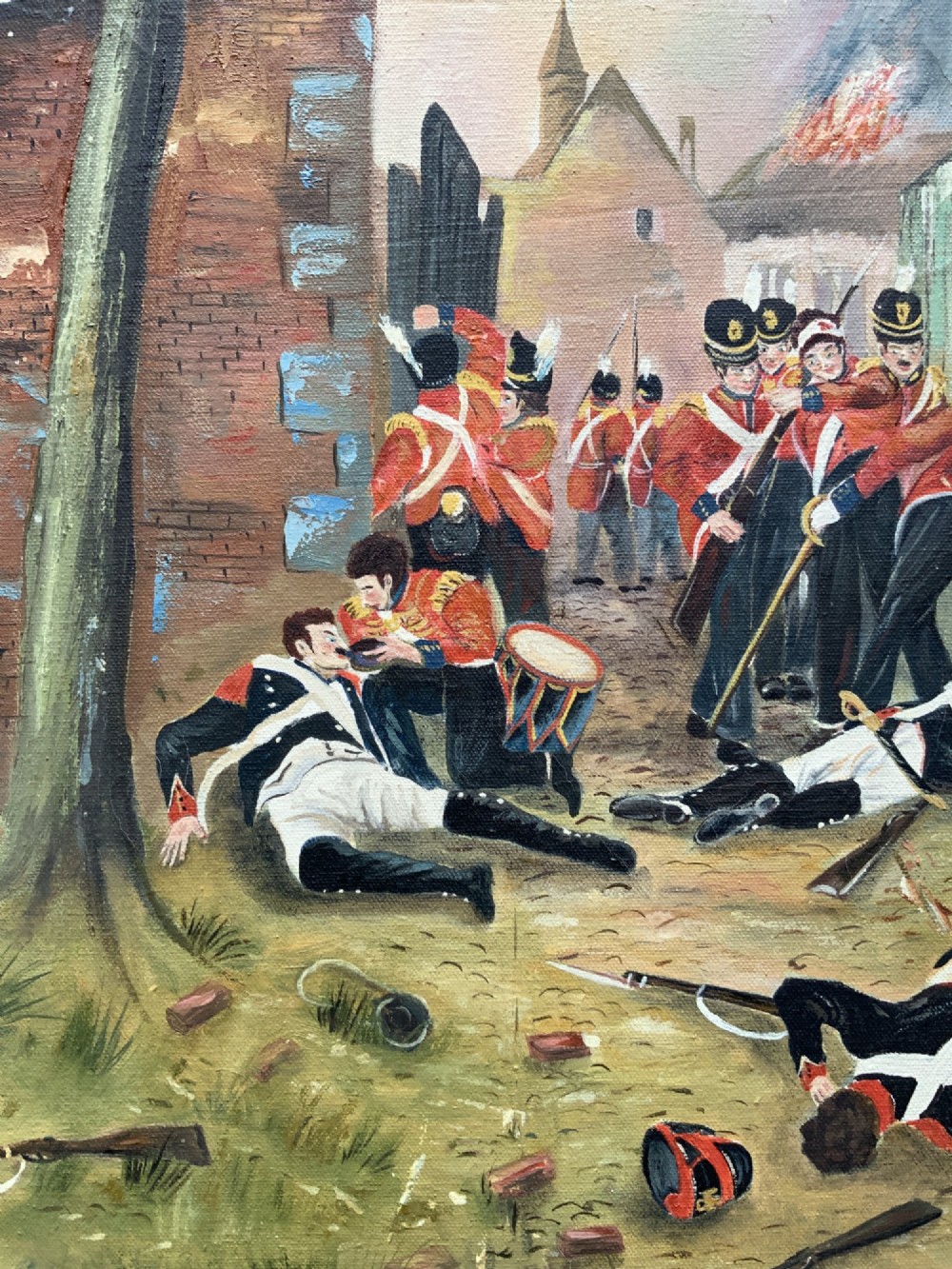 A framed oil painting depicting soldiers in red coats defending the North Gate of Hougoumont during the Battle of Waterloo. View VIII