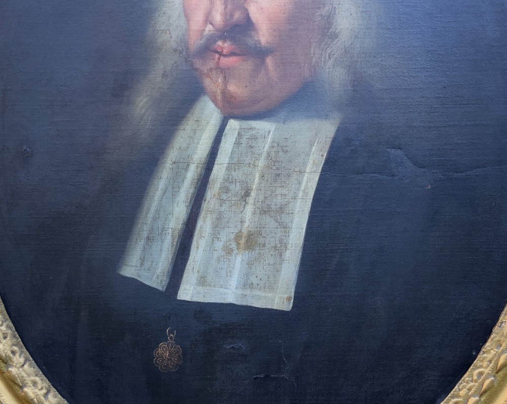 An oval 17th-century oil painting depicting a gentleman with grey hair, a moustache, and white falling bands collar in a carved gold frame. View VIII