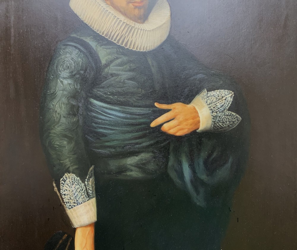 A full-length oil painting depicting a 17th-century gentleman in a dark doublet and white ruff collar, set within a black and gold frame. View V