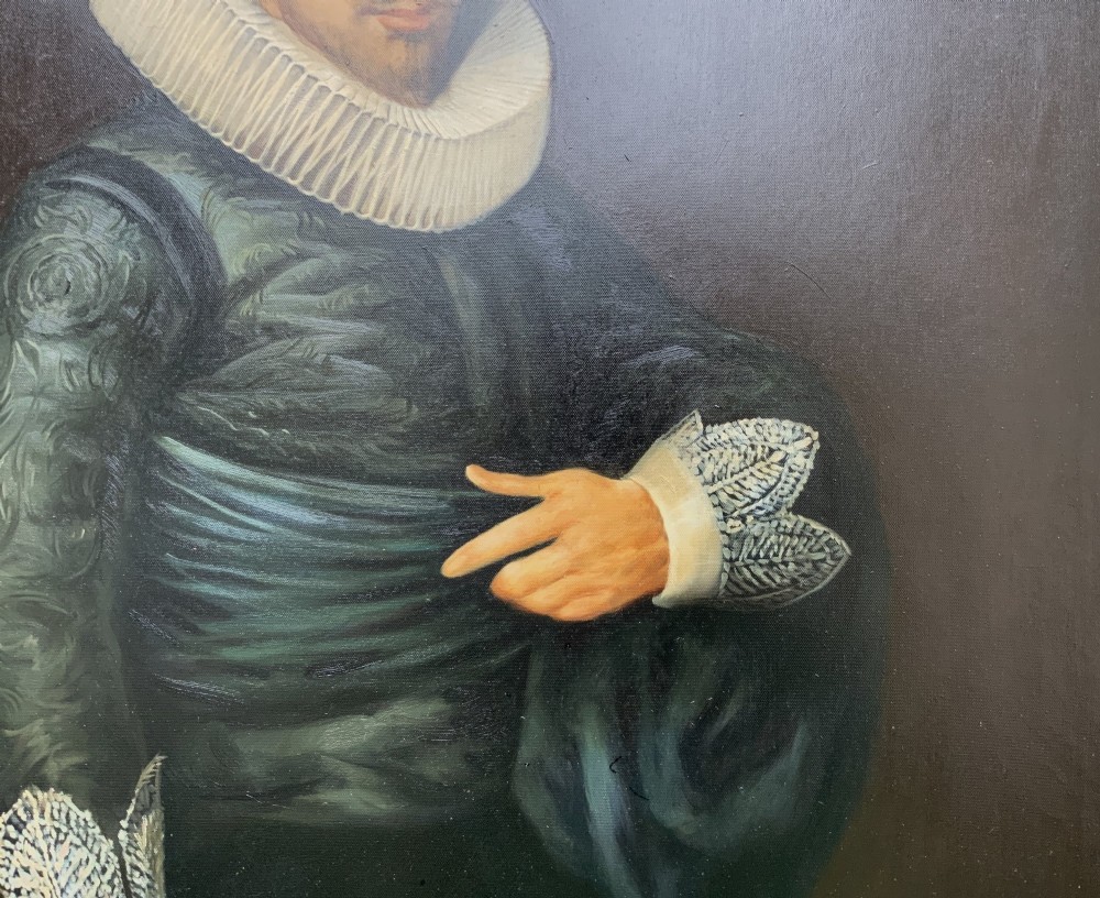 A full-length oil painting depicting a 17th-century gentleman in a dark doublet and white ruff collar, set within a black and gold frame. View X
