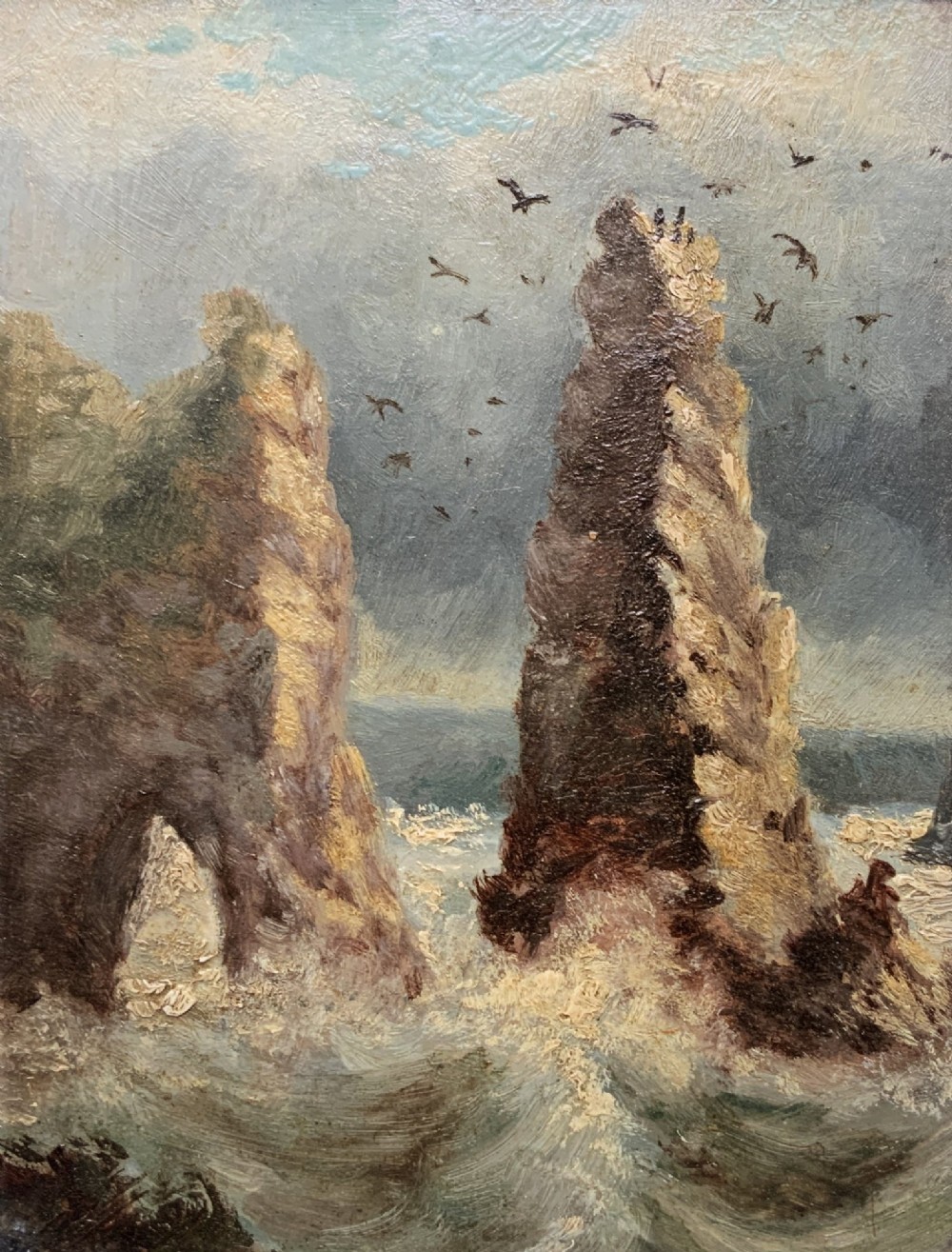 A 19th-century miniature oil painting depicting coastal rock formations in sea swell, set within a dark wooden frame with a white slip. View II
