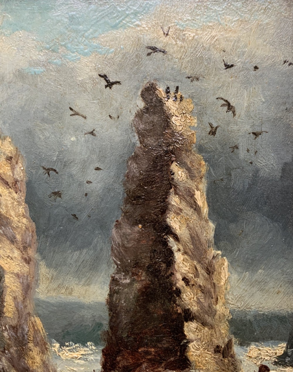 A 19th-century miniature oil painting depicting coastal rock formations in sea swell, set within a dark wooden frame with a white slip. View VIII