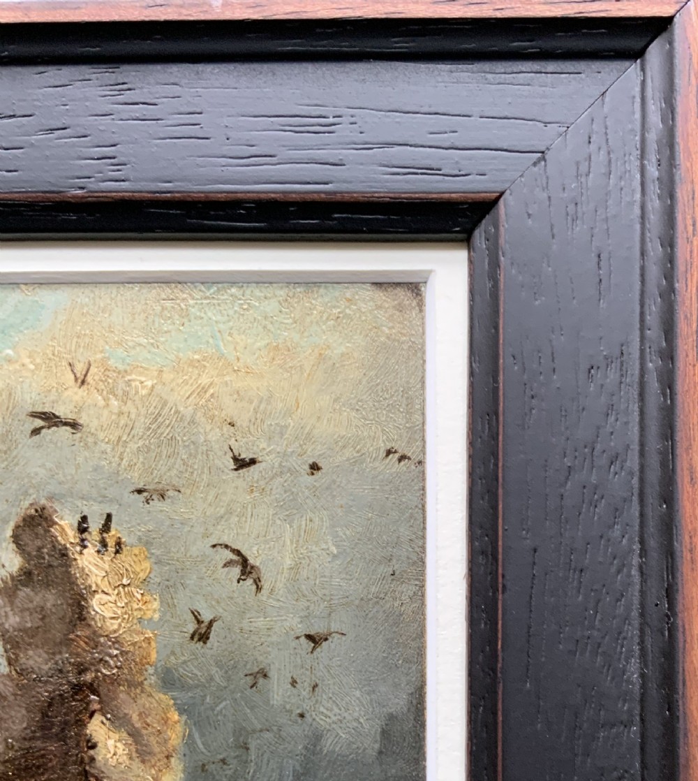 A 19th-century miniature oil painting depicting coastal rock formations in sea swell, set within a dark wooden frame with a white slip. View IX
