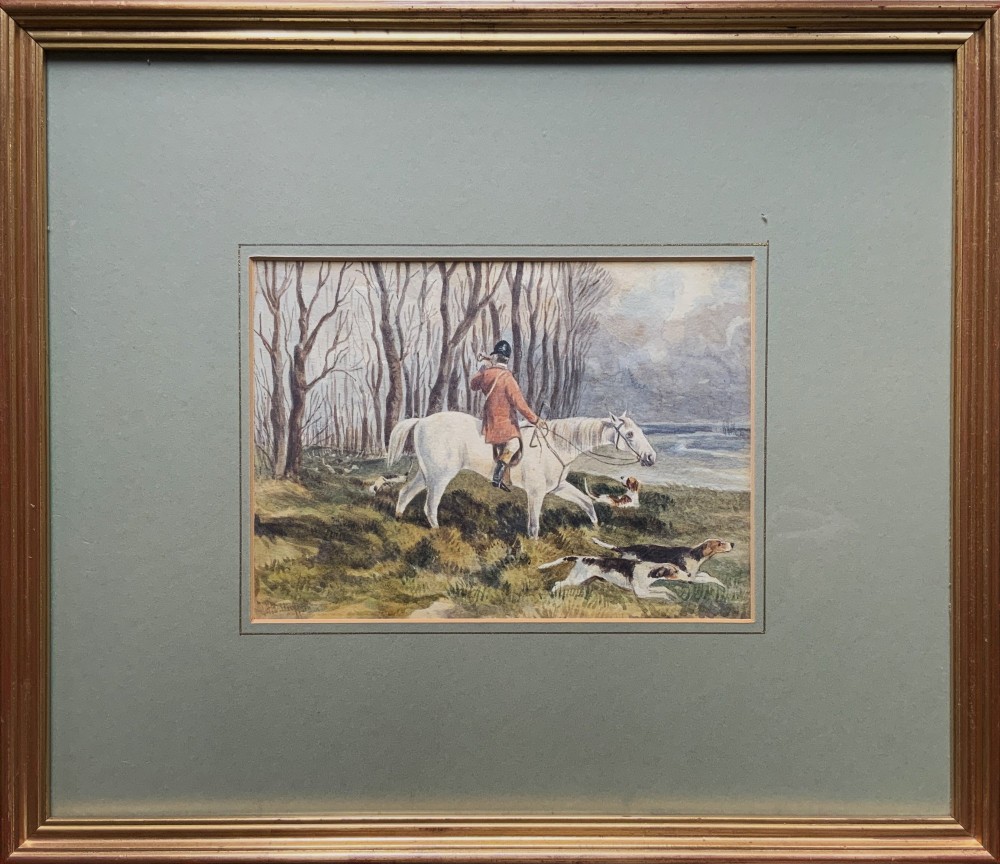 A framed 19th-century watercolour painting depicting a huntsman in a red coat riding a white horse alongside hunting hounds through a woodland landscape.