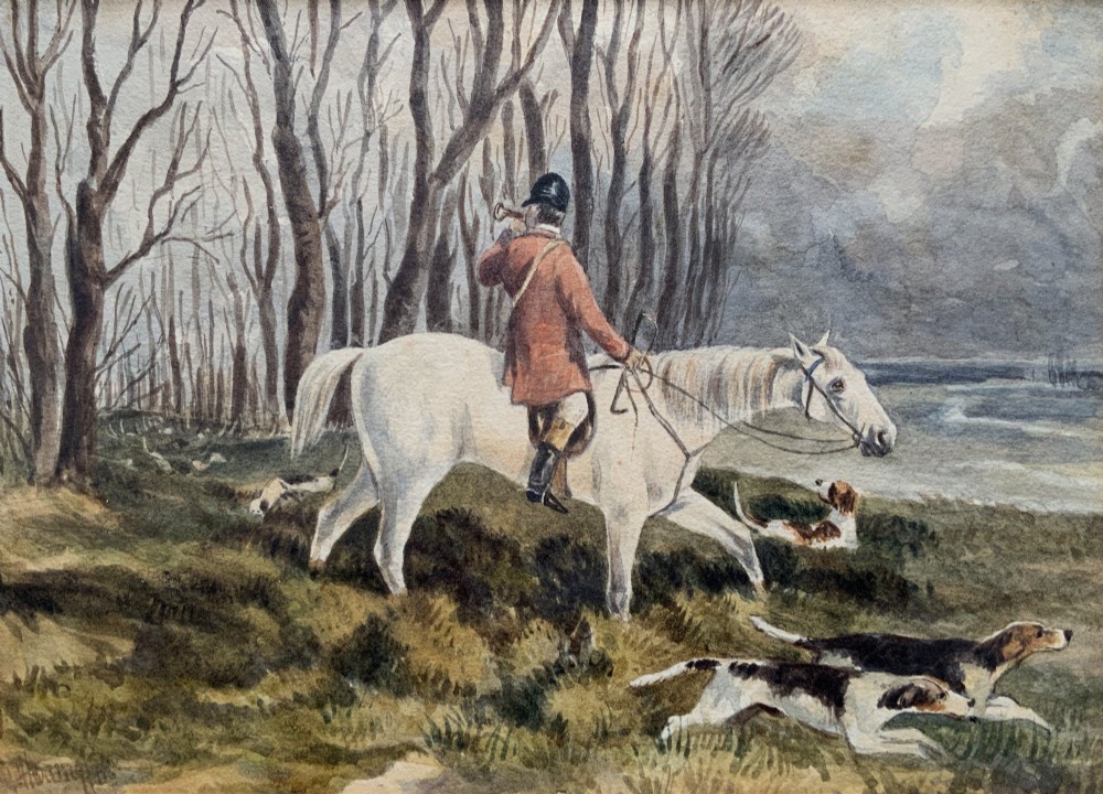 A framed 19th-century watercolour painting depicting a huntsman in a red coat riding a white horse alongside hunting hounds through a woodland landscape. View II