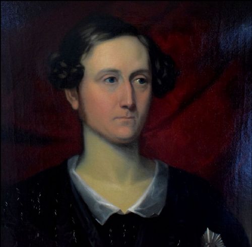 fig 3. An antique oil portrait on canvas showing a half-length depiction of a man in dark clothing with a star decoration against a crimson background.