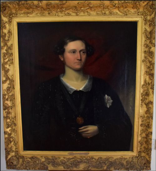 fig 4. An antique oil portrait on canvas showing a half-length depiction of a man in dark clothing with a star decoration against a crimson background.